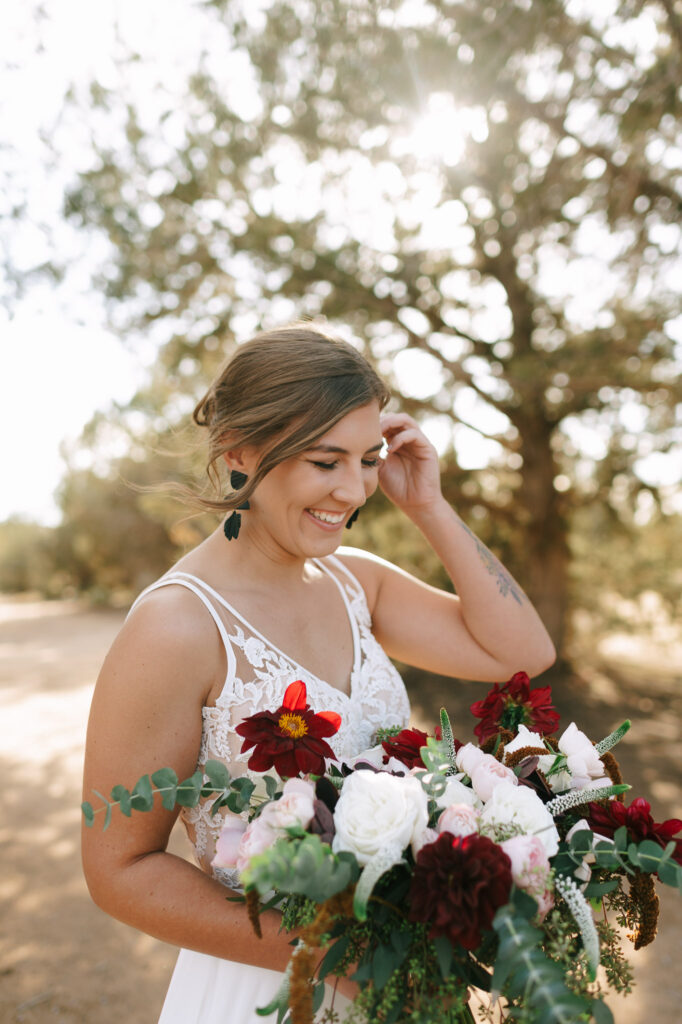 Nicole laughs during her bridal portraits before she heads down the aisle for her Zion National Park elopement