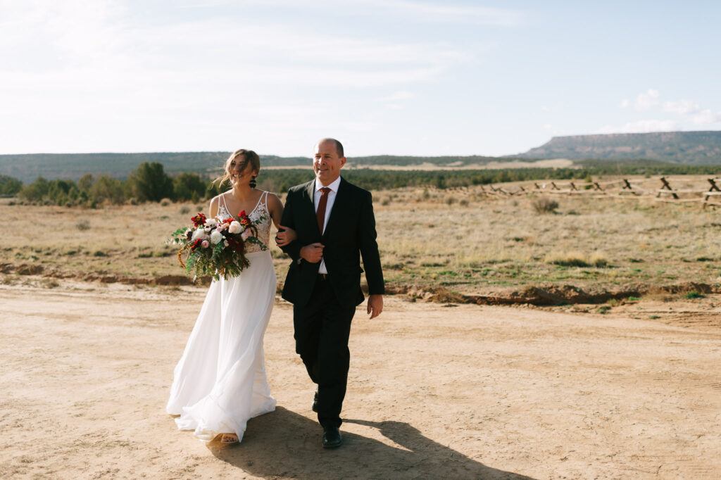Nicole and her father walk down the aisle for her Zion National Park elopement