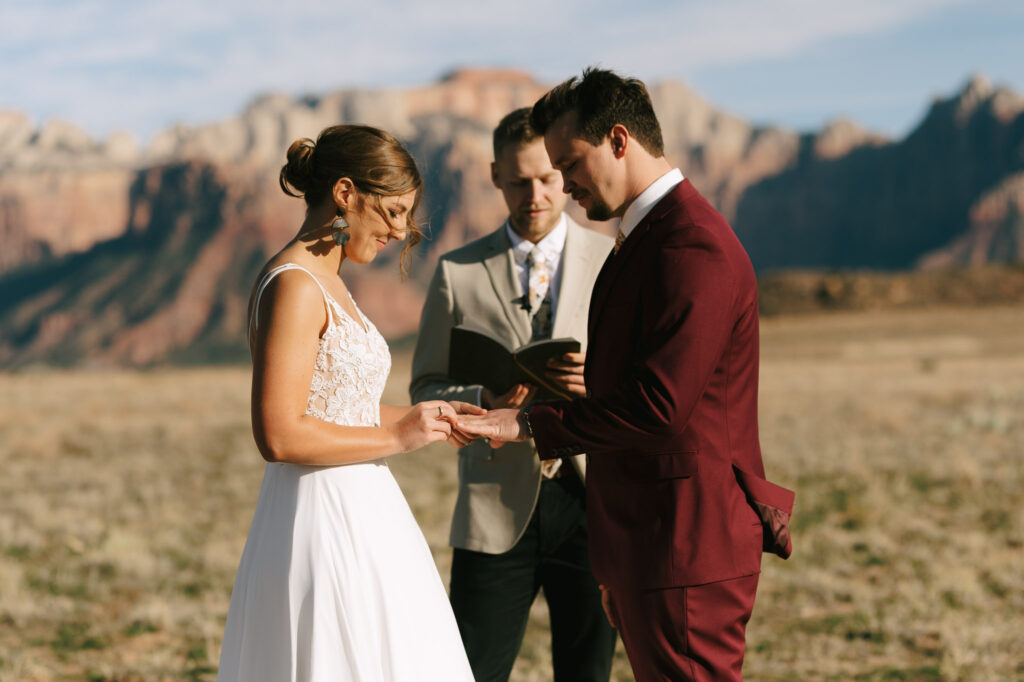 Kaleb and Nicole exchange rings during their Zion National Park elopement