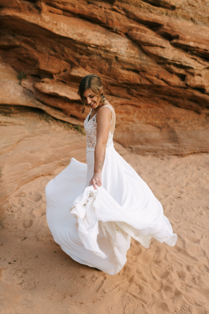Nicole twirls, showing off her dress at Zion National Park