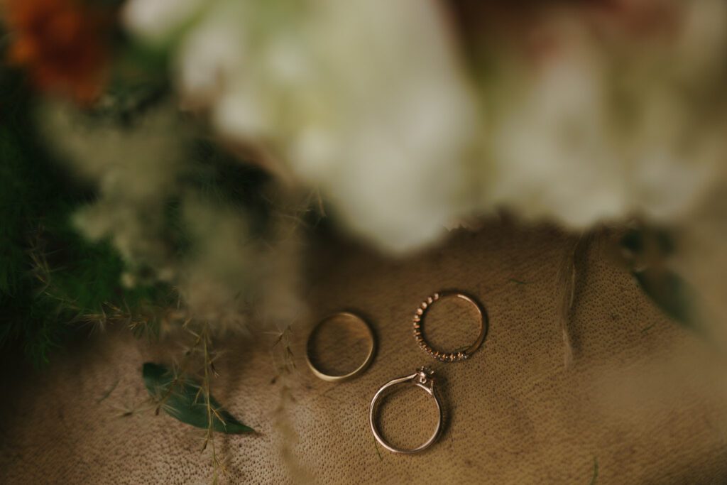 Rings sit by flowers