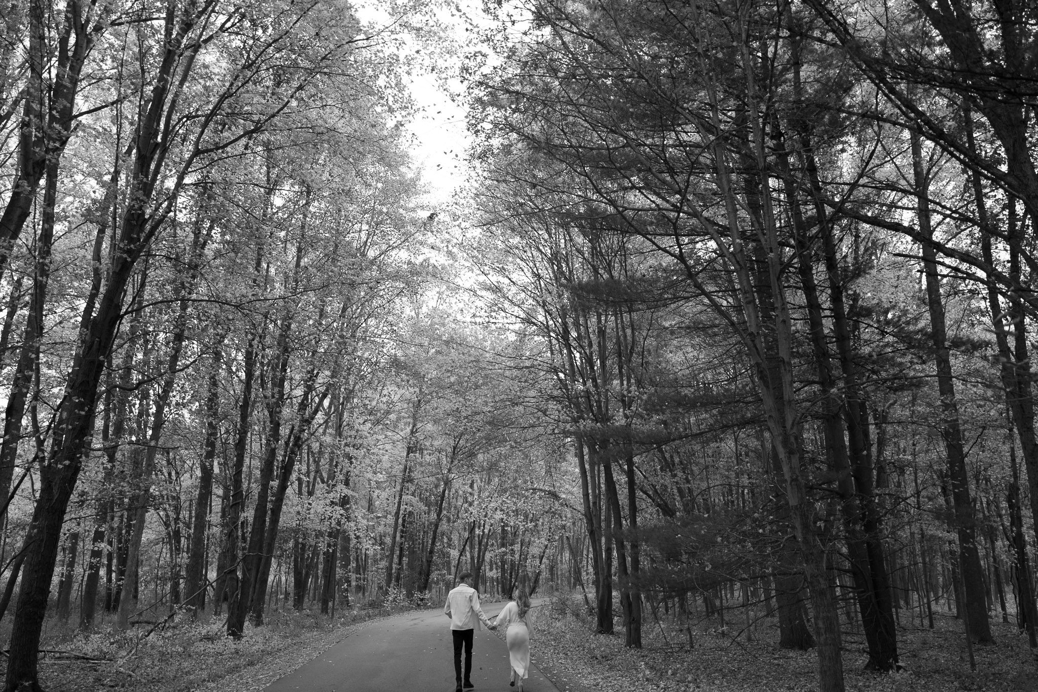 Sophia and Brad  walk through the woods 