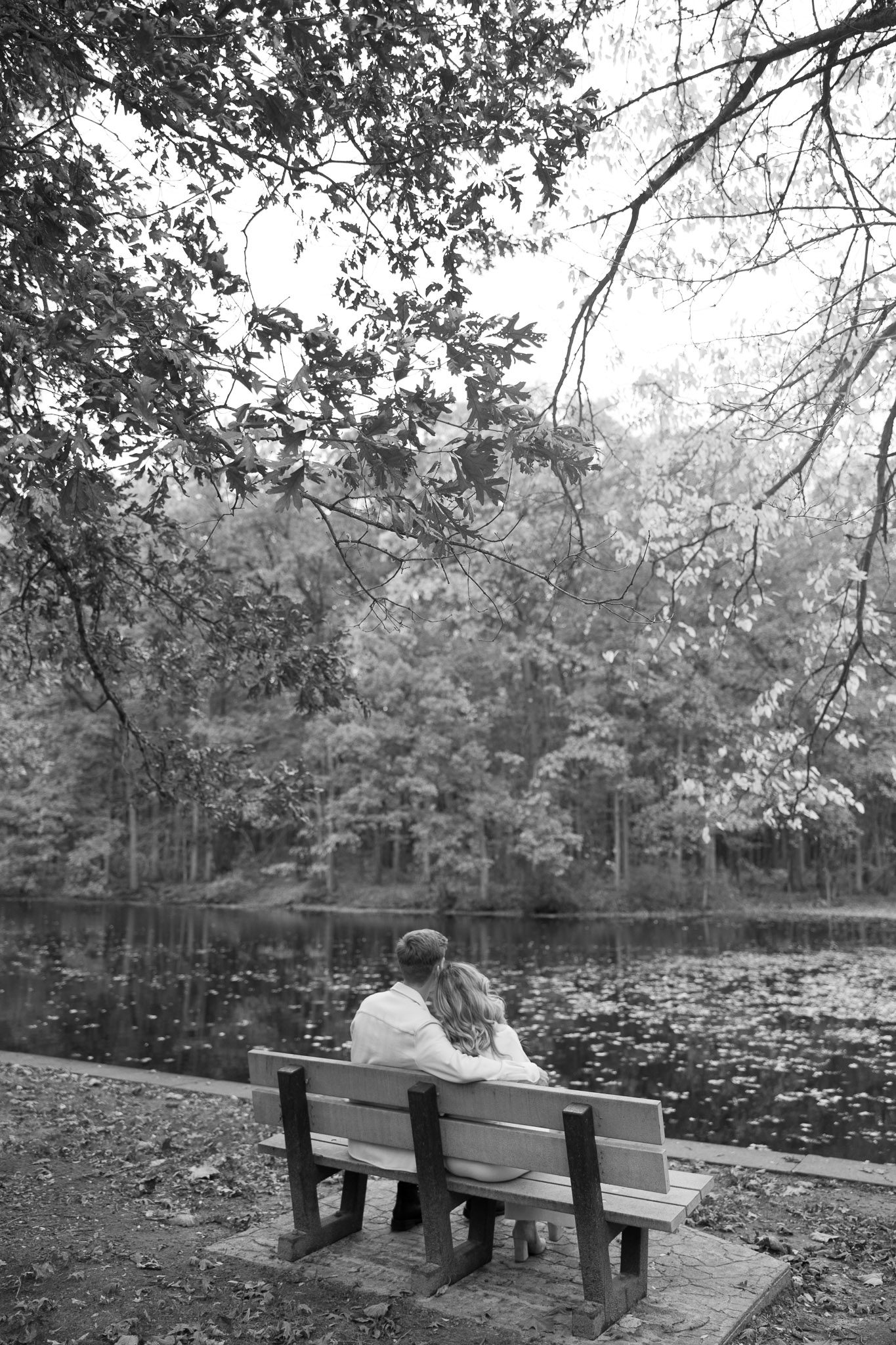 Sophia and Brad sit on a bench