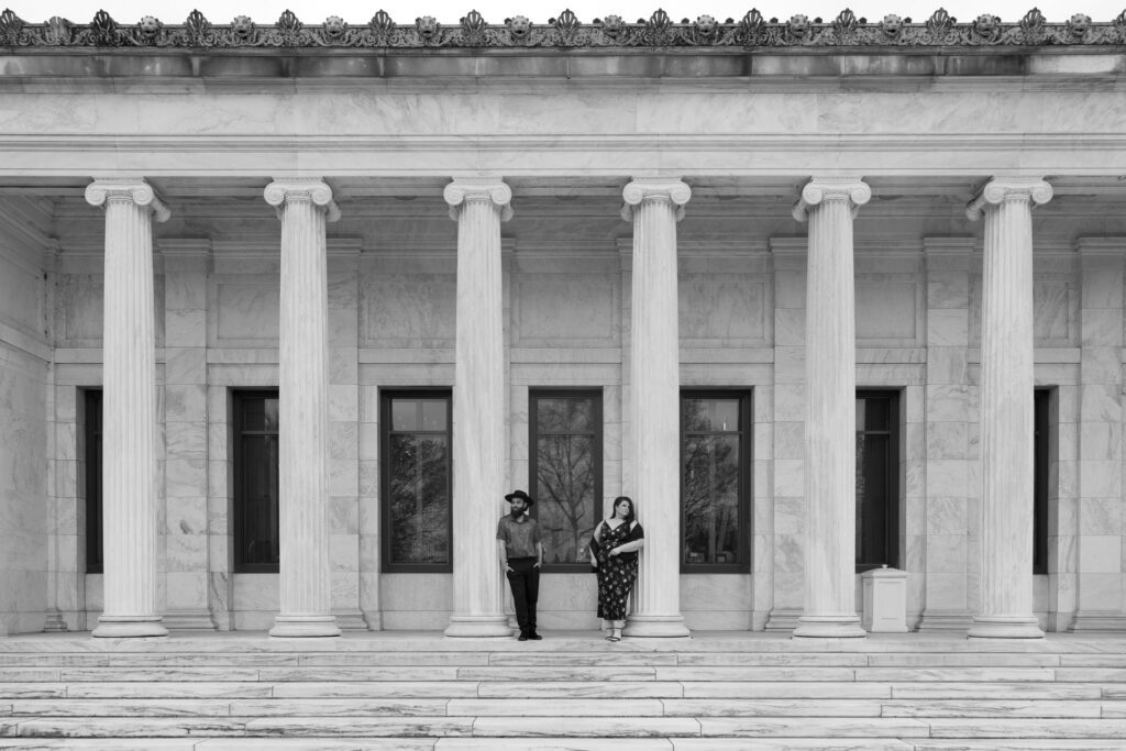 Adam and Bethany stand next to each other at the Monroe Street entrance of the Museum