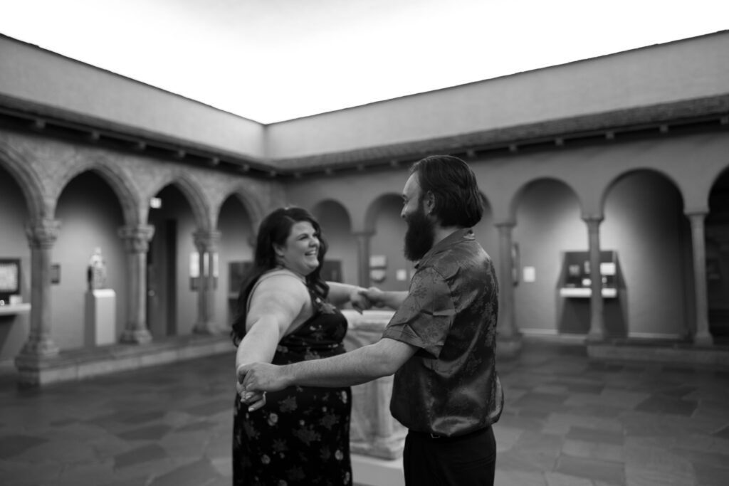 Adam and Bethany dance in the cloister gallery of the art museum