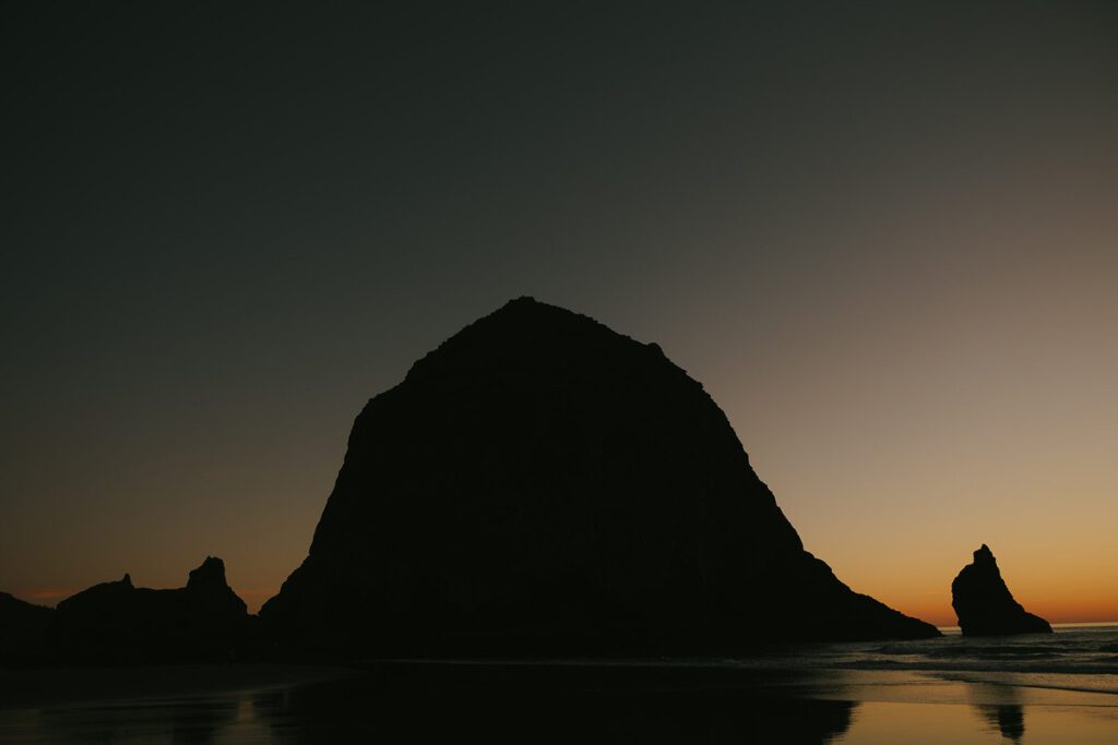 A view of Haystack Rock on Cannon Beach in Oregon at Sunset