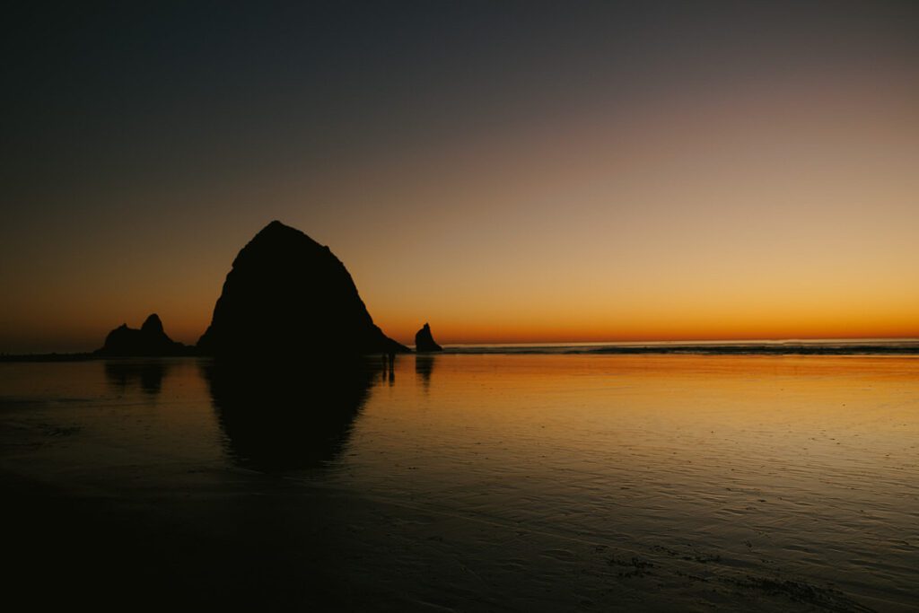 A view of Haystack Rock on Cannon Beach in Oregon at Sunset