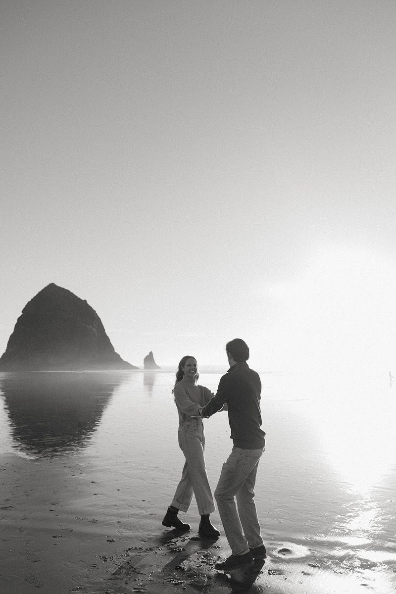 J&L spin on the beach for their engagement photos