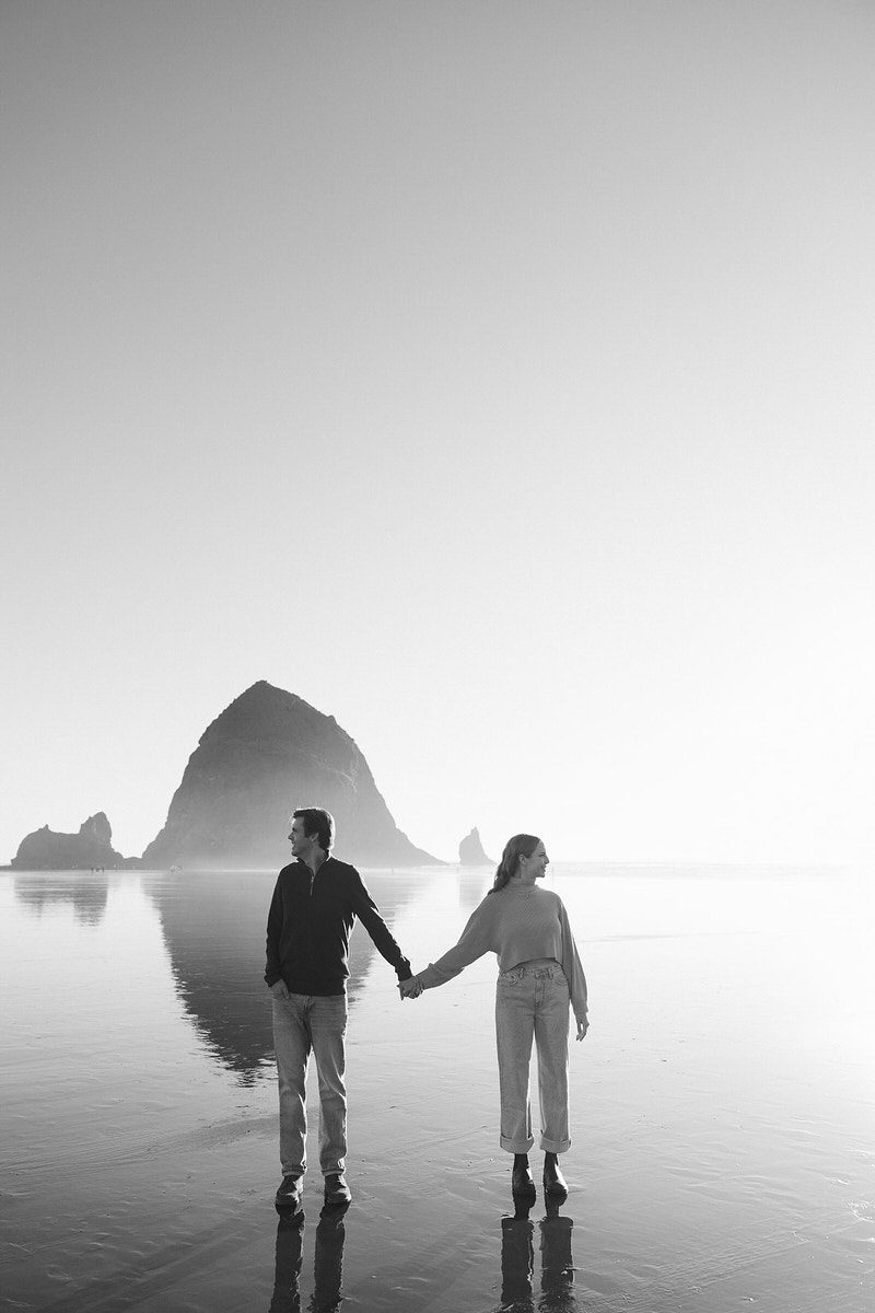 J&L stand on their beach for their Cannon Beach engagement