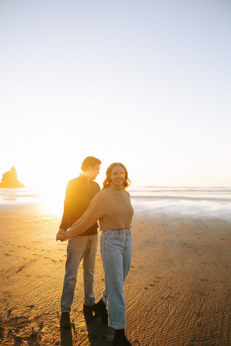 Jason and Leah embrace on the beach