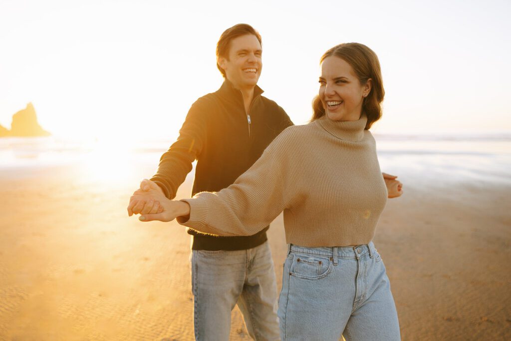 Jason and Leah embrace on the beach