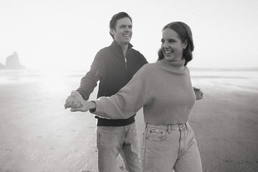 Jason and Leah embrace on the beach