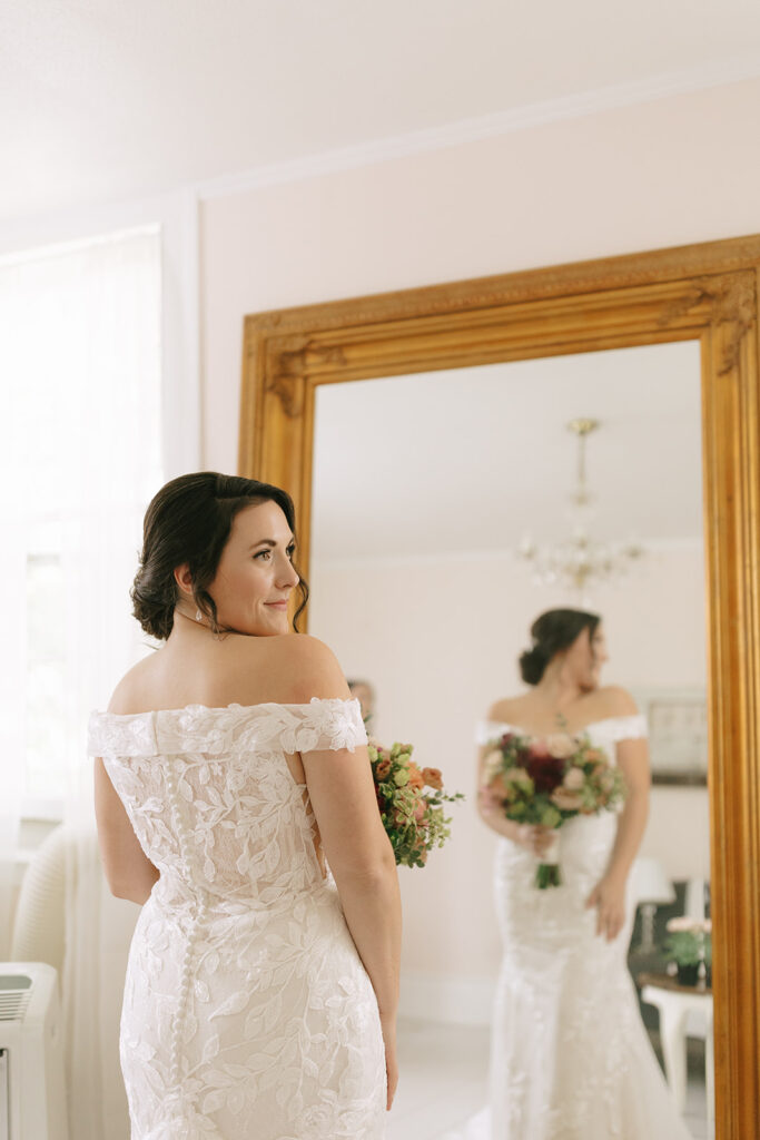 Bride looks over her shoulder 