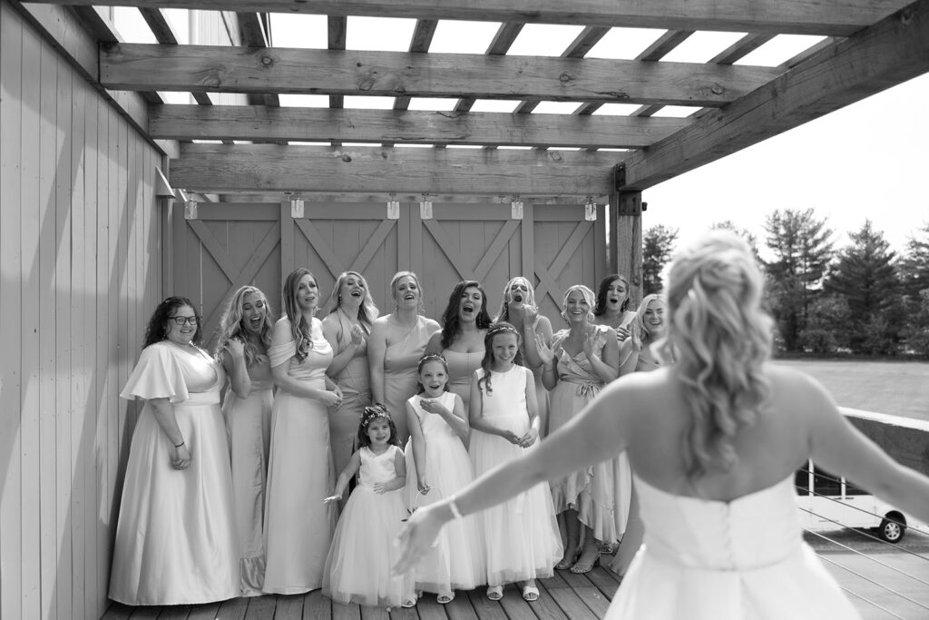 Bridesmaids gasp when they see their friend