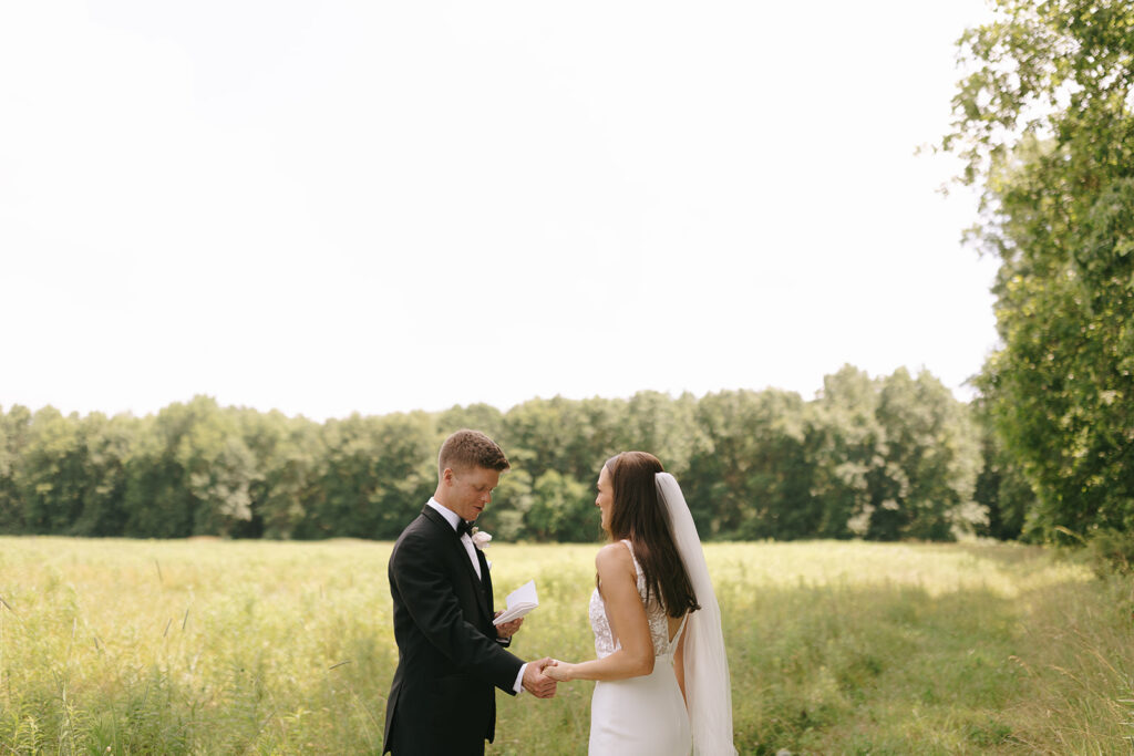 The couple exchanges their vows during their first look