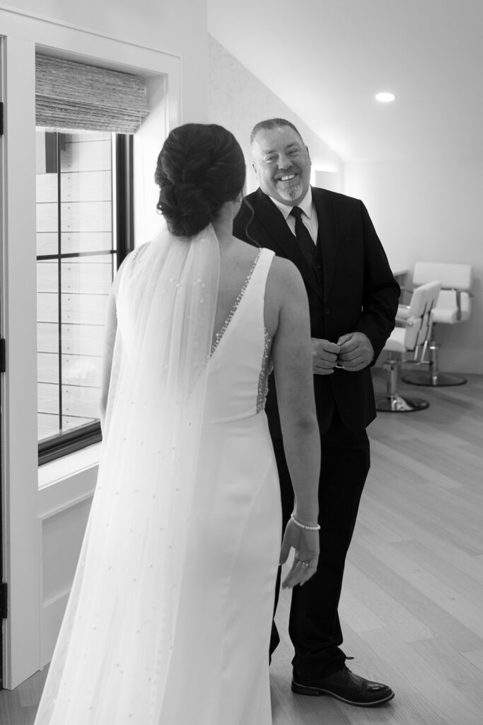 Paige's dad turns to see her in her wedding dress