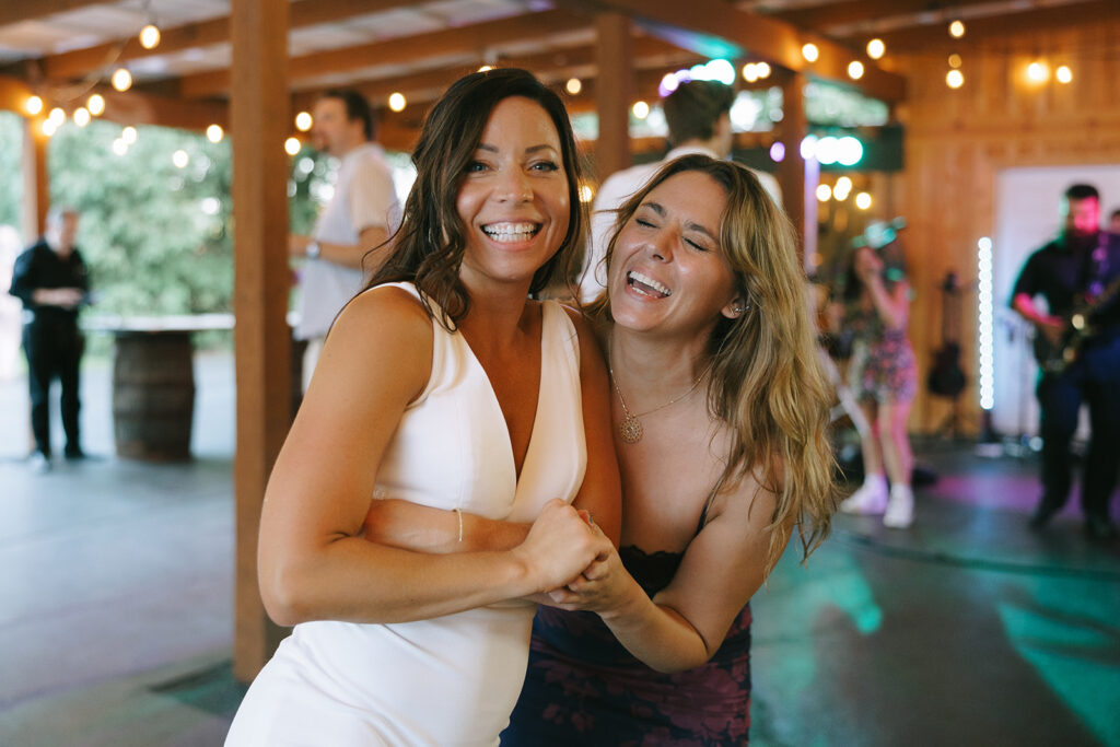 Karis and her friend take to the dance floor at their wedding reception at Bloom and Bower