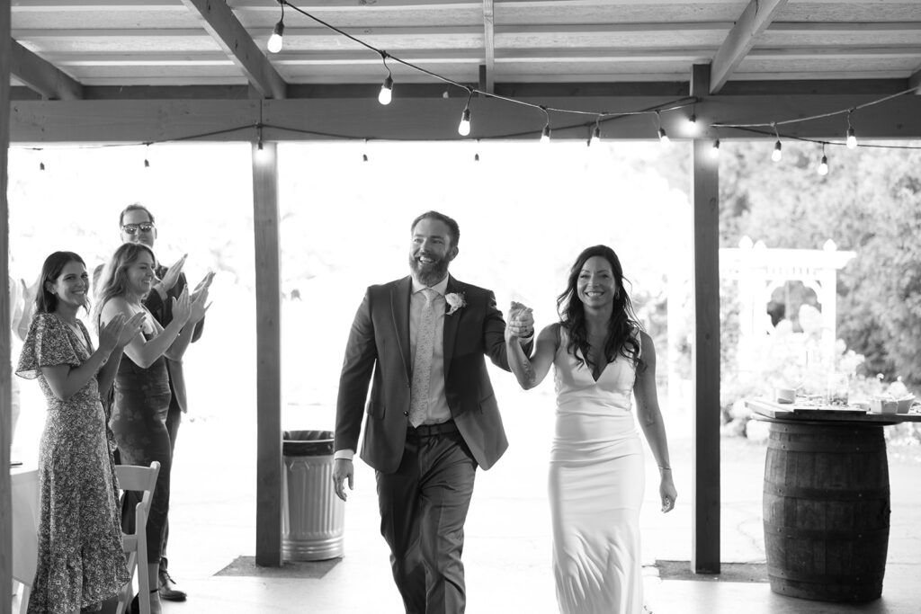 Karis and Tony have their grand entrance during their wedding reception at Bloom and Bower