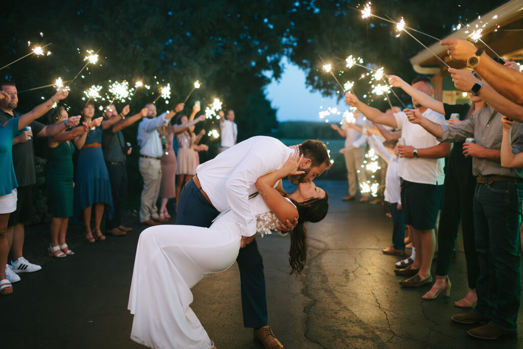 Tony dips Karis during their sparkler exit