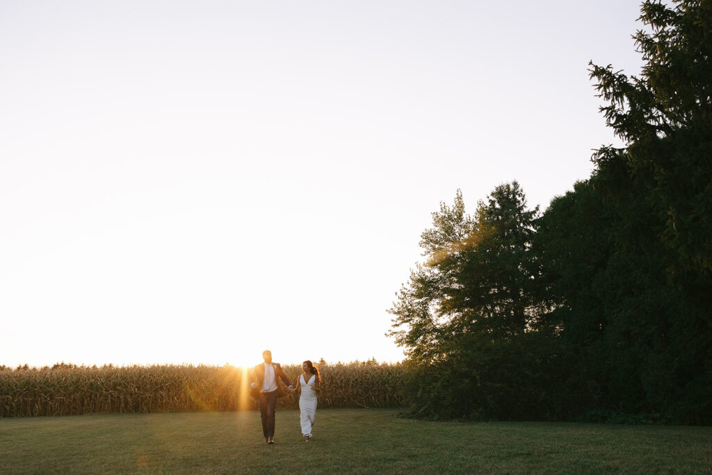 Karis and Tony run during sunset at Bloom and Bower, an Ohio wedding venue