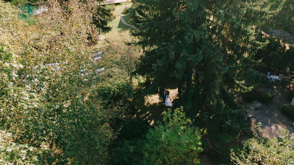 aerial view of Karis and Tony embracing in the garden at Bloom and Bower