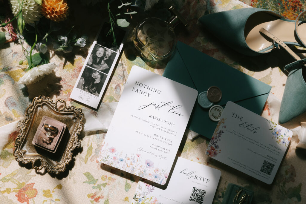 A collection of the couples wedding day details in flatlay format