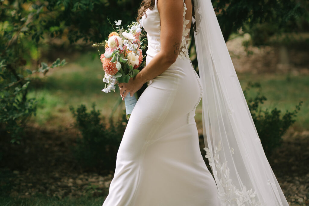 a close up of Karis walking down the aisle at her wedding at Bloom and Bower