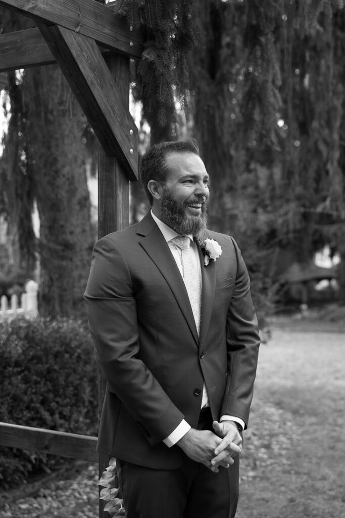 Tony watches as Karis comes down the aisle at Bloom and Bower, carrying her wildflower bouquet and wearing a custom bridal gown