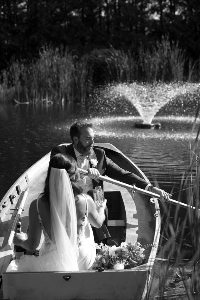 Tony starts to push off the canoe for their champagne ride in the water at Bloom and Bower