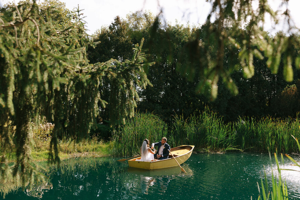 Karis and Tony paddle around the lake at Bloom and Bower before enjoying their champagne toast after their wedding ceremony