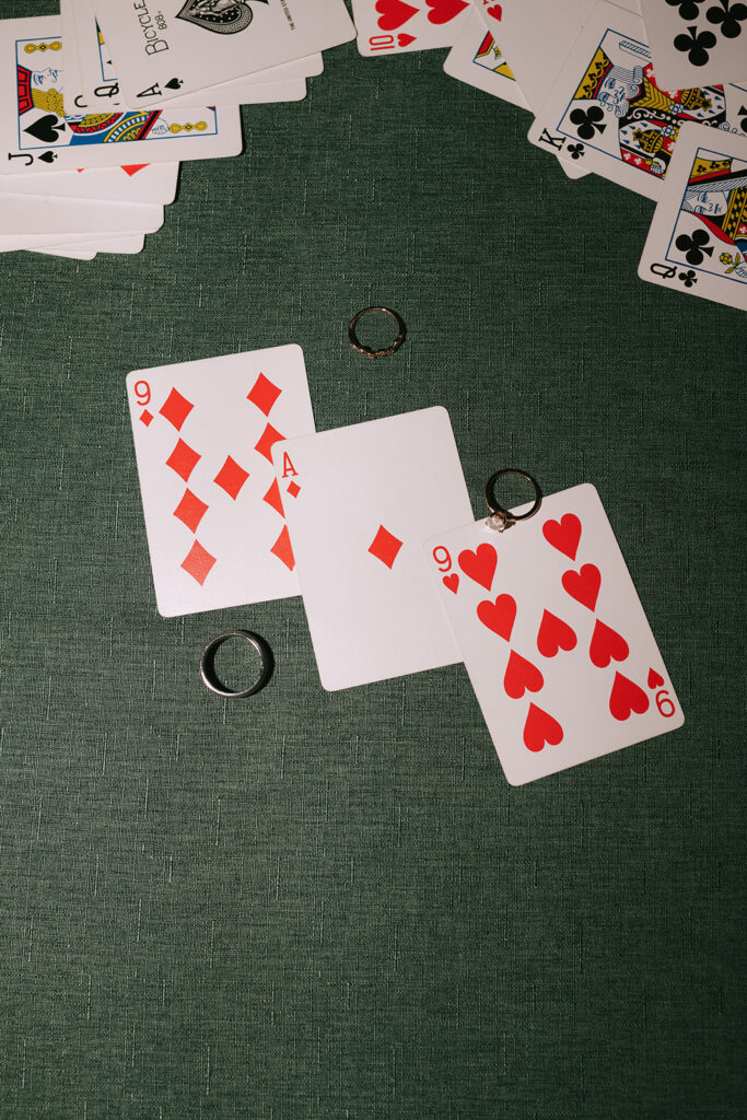 The couples wedding rings sit on the pool table upstairs at Bloom and Bower with cards that read their wedding date -- 9/19