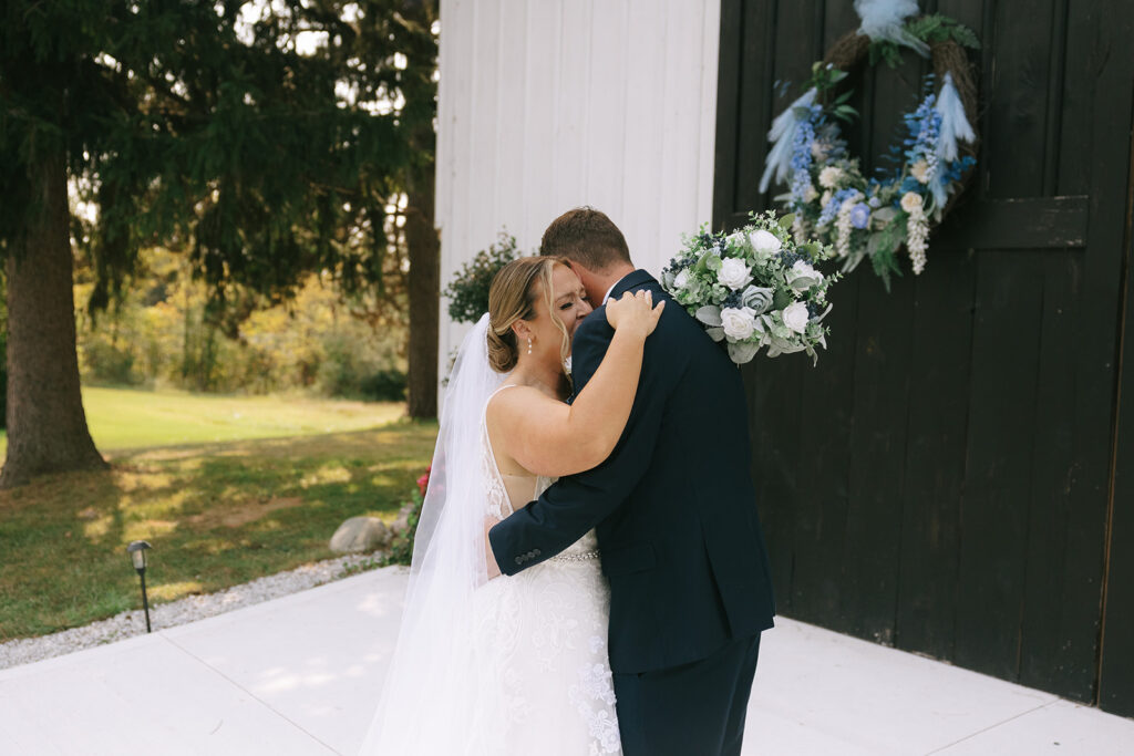 Bride and groom embrace during their emotional first look, showing why couples choose a First Look vs No First Look experience on their wedding day.