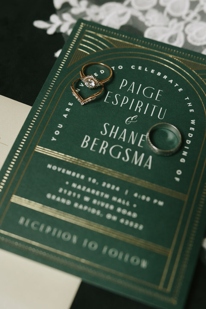 wedding detail photos with bride and grooms ring as well as the veil and wedding invite
