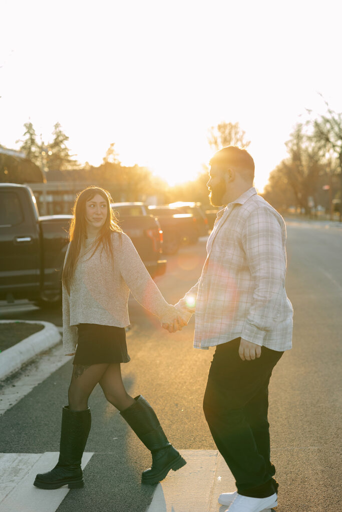 Urban engagement session in front of a historic building, great for blog posts about creative engagement photo ideas and wedding planning steps.