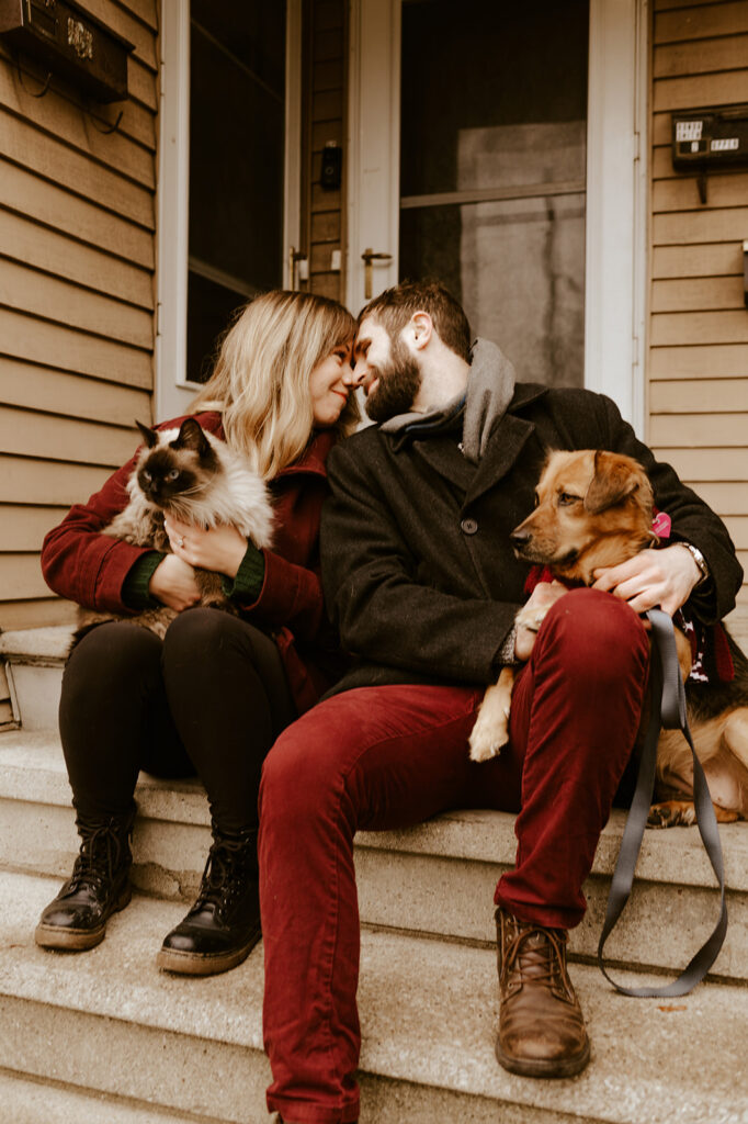 Couple with both their dog and cat at their engagement session