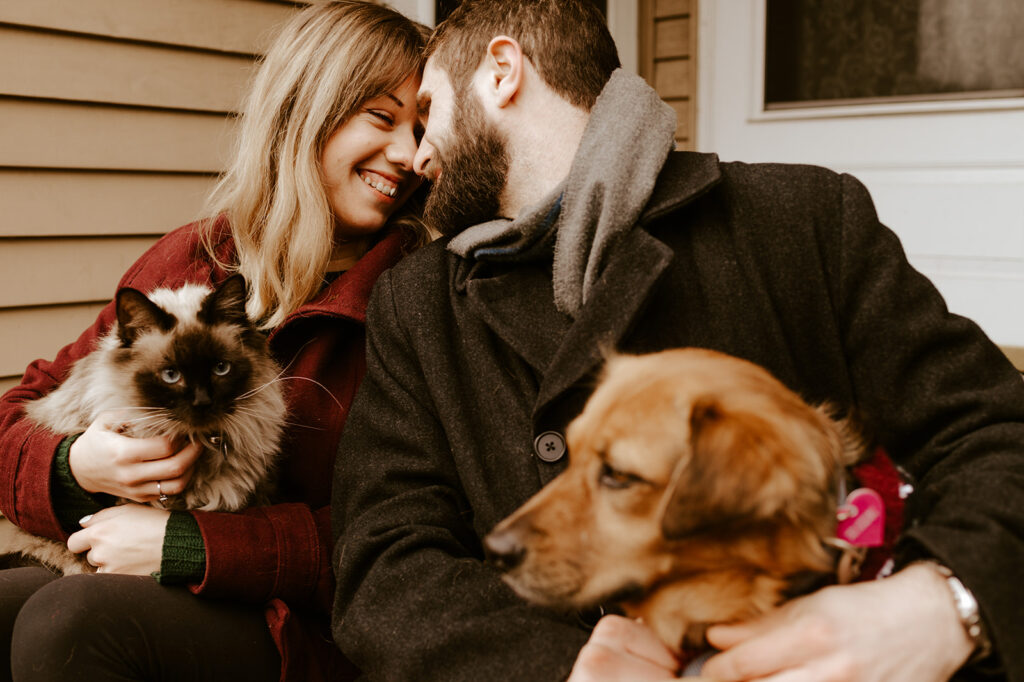 Couple with both their dog and cat at their engagement session