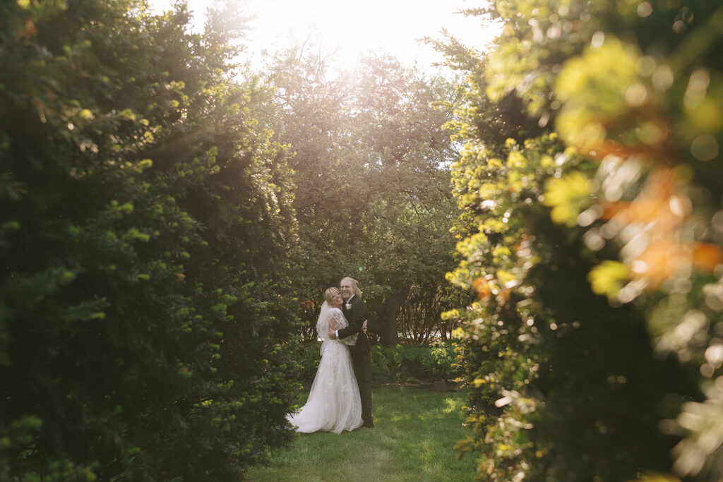Bride and groom hugging tightly in a quiet moment to ease their prewedding nerves

