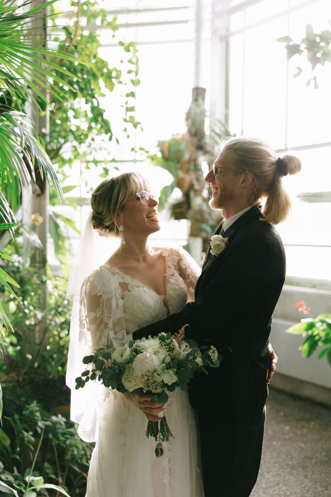 Bride and groom smiling at each other, feeling the prewedding nerves melt away


