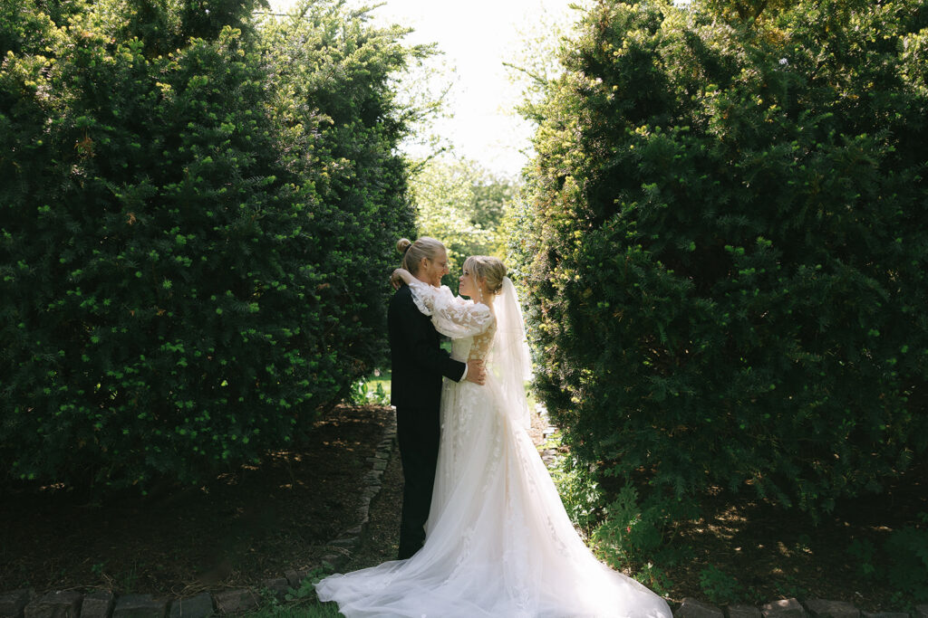 Bride and groom holding hands and sharing a laugh to ease prewedding nerves