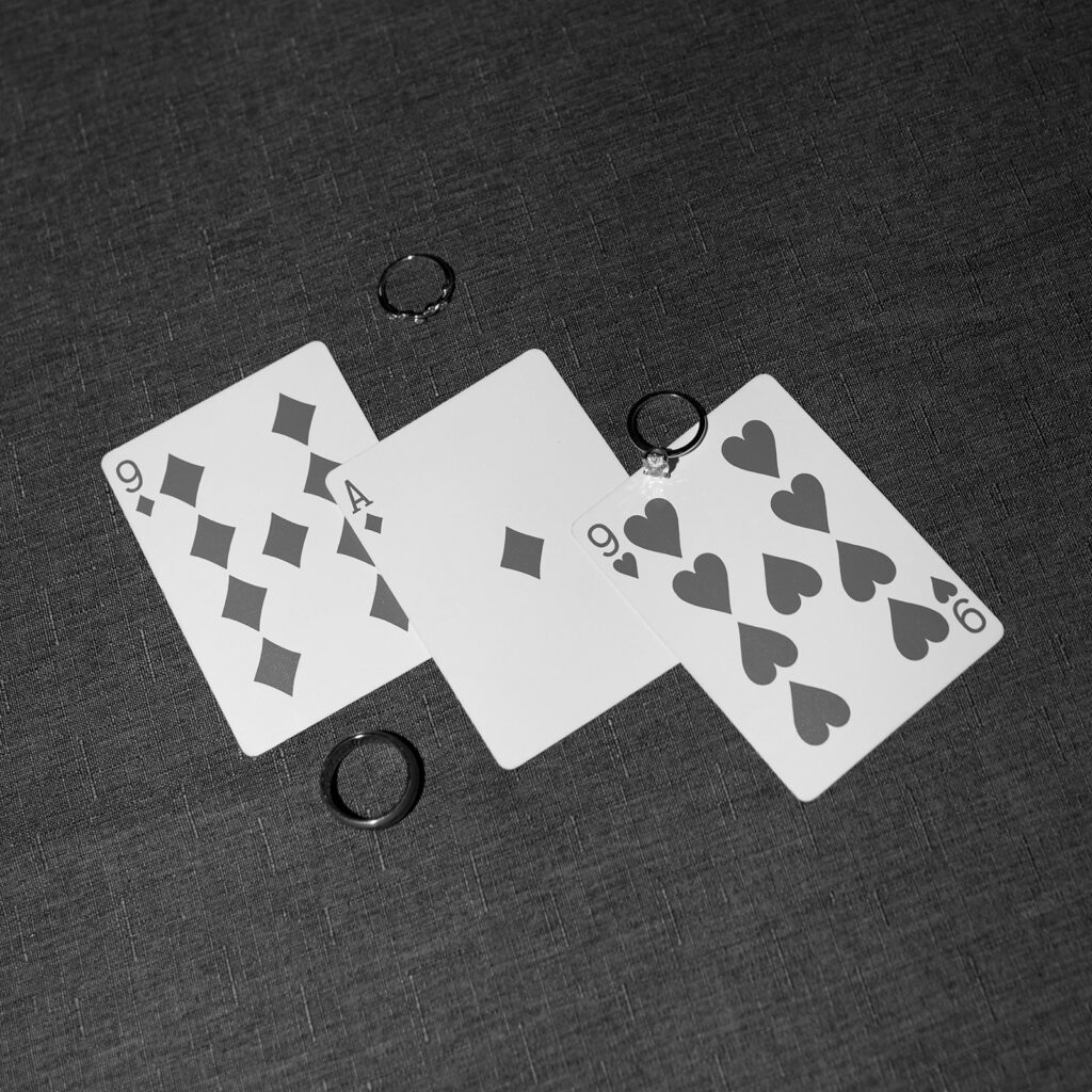 Black and white playing card detail shots and rings. Wedding day gift ideas