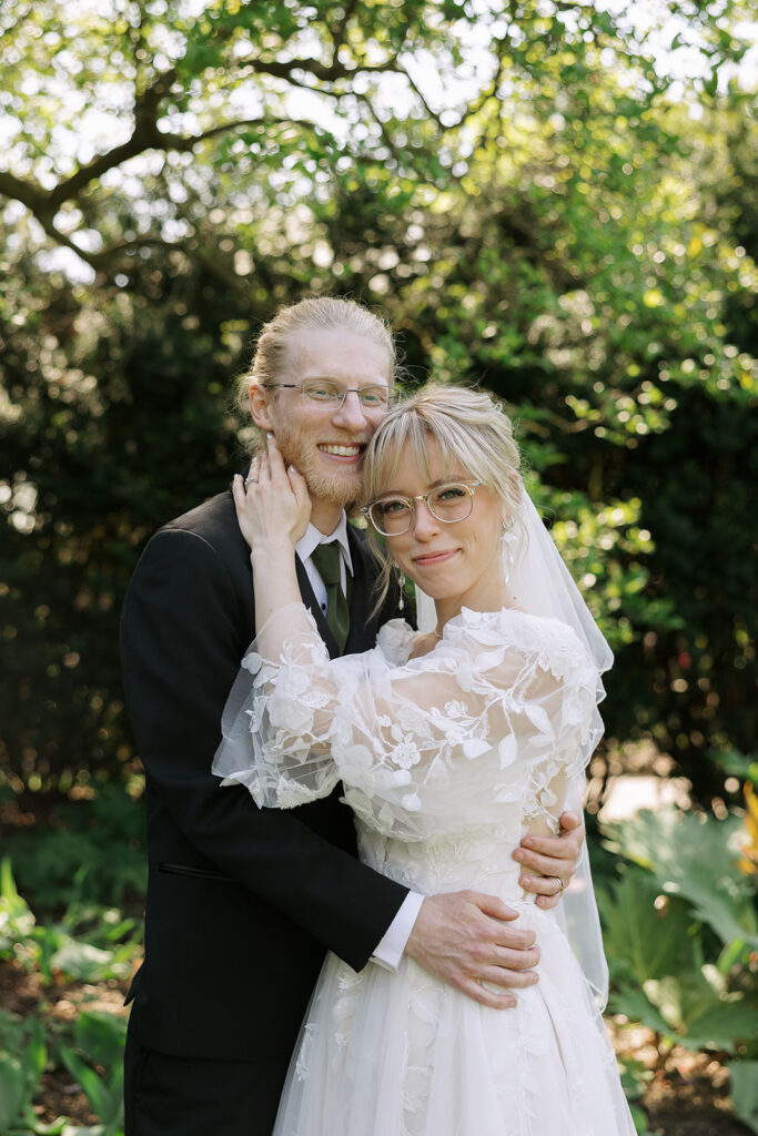Romantic outdoor wedding portraits of couple embracing, example of complete wedding gallery photography.