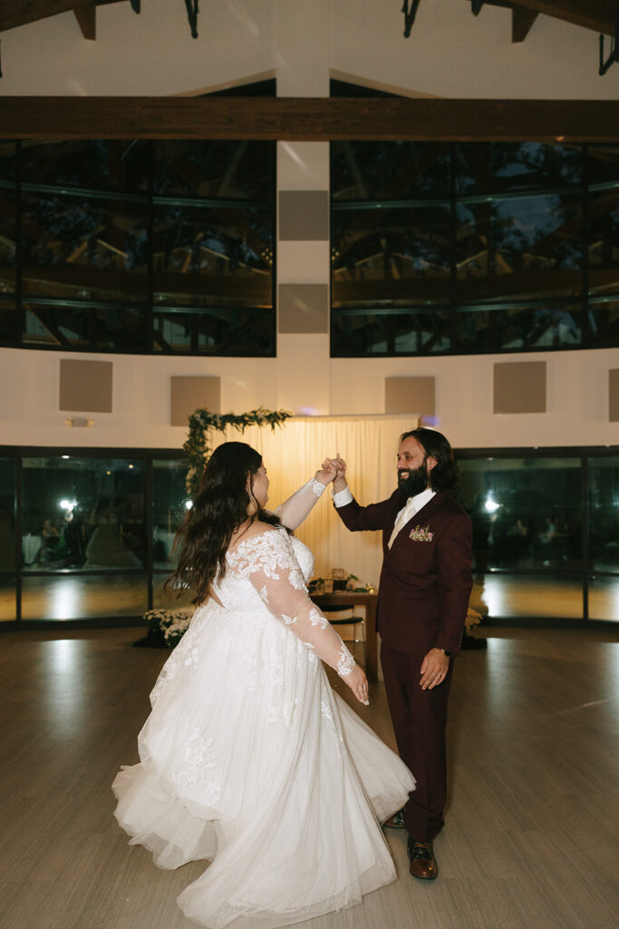 Bride and groom sharing their first dance in modern venue, celebrating smooth transitions from preparation to reception in tips for the morning of your wedding.