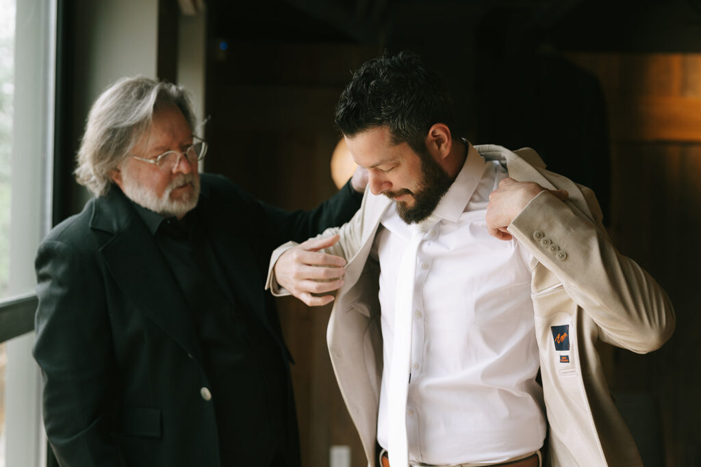 A groom getting ready with an important family member.