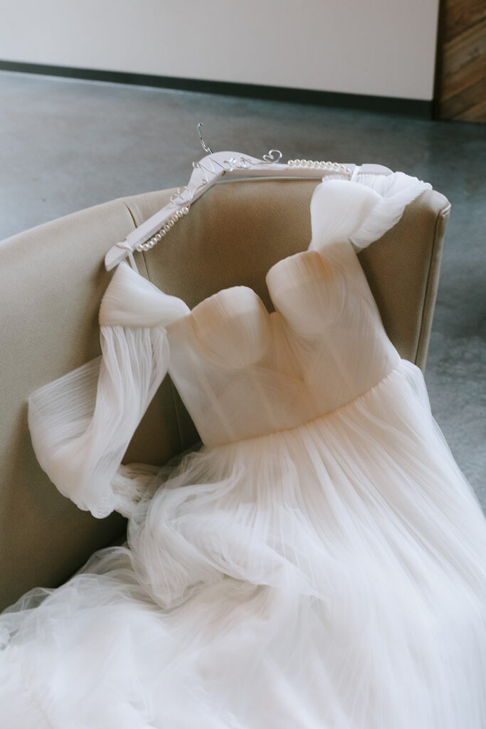 Getting-Ready and Detail Shots, a wedding gown on a chair.