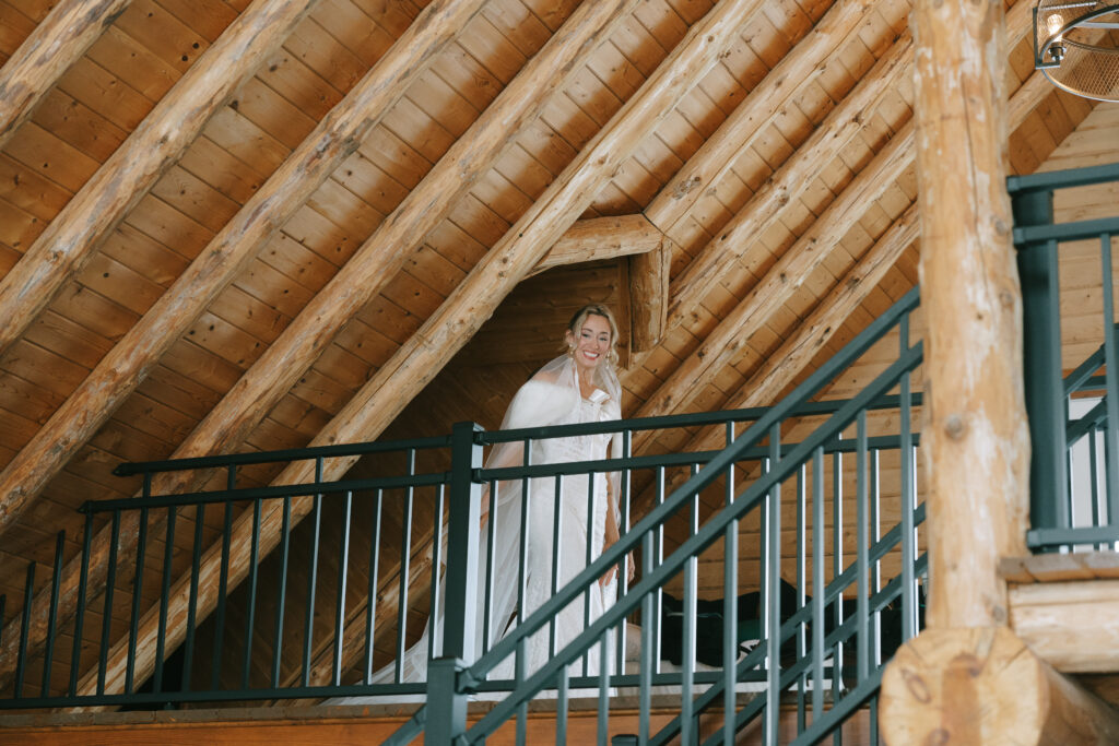 Bride in a wood panneled home as part of their wedding day rain plan.