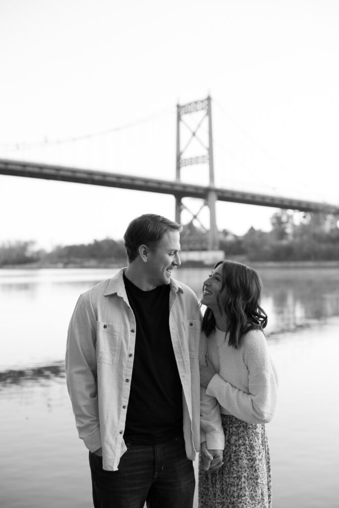 Black and white exposure of a couple looking at each other during their engagement photos for camera-shy couples.