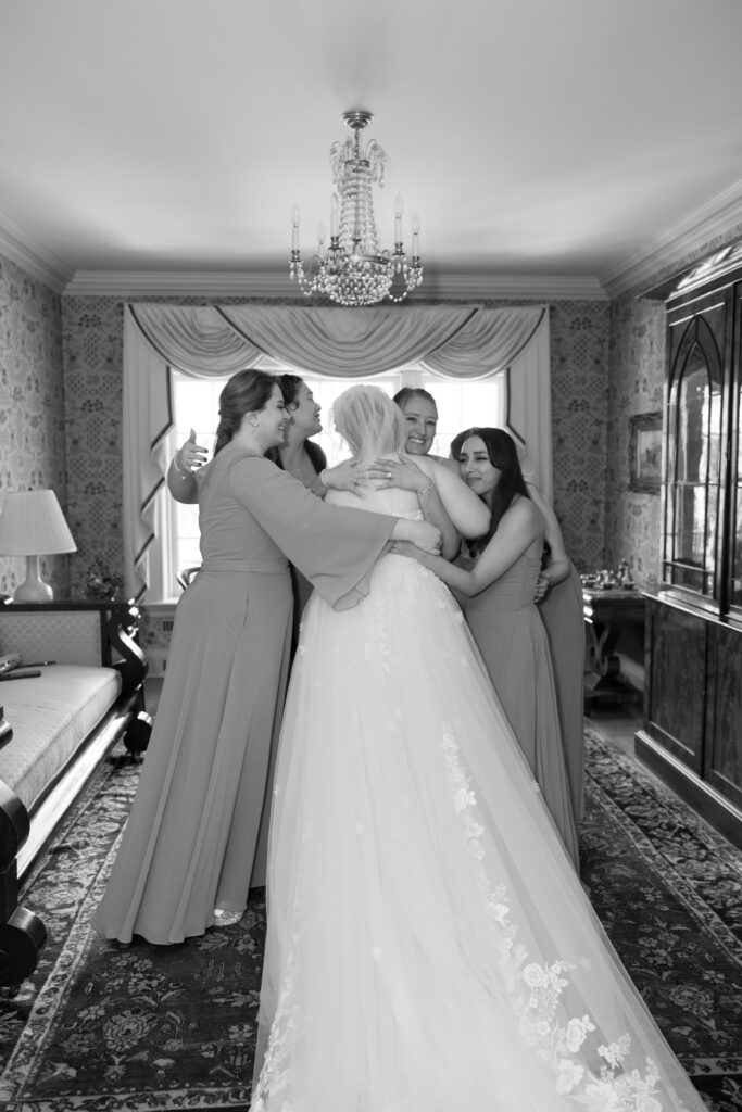 Candid wedding photo of a bride and her bridal party.