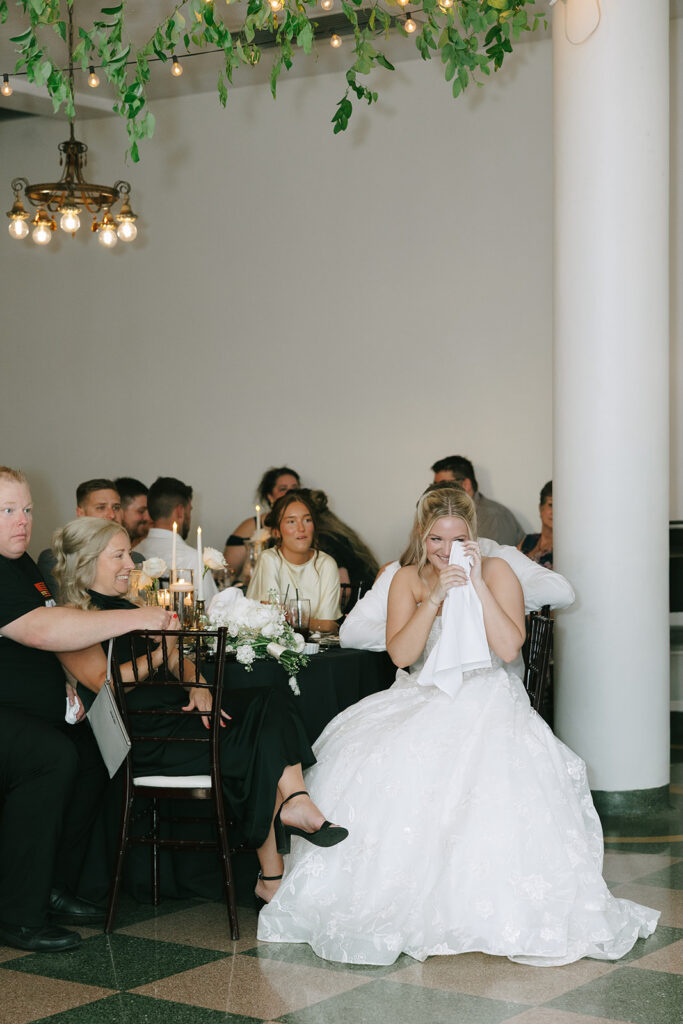 Candid wedding Photograph during speeches bride crying