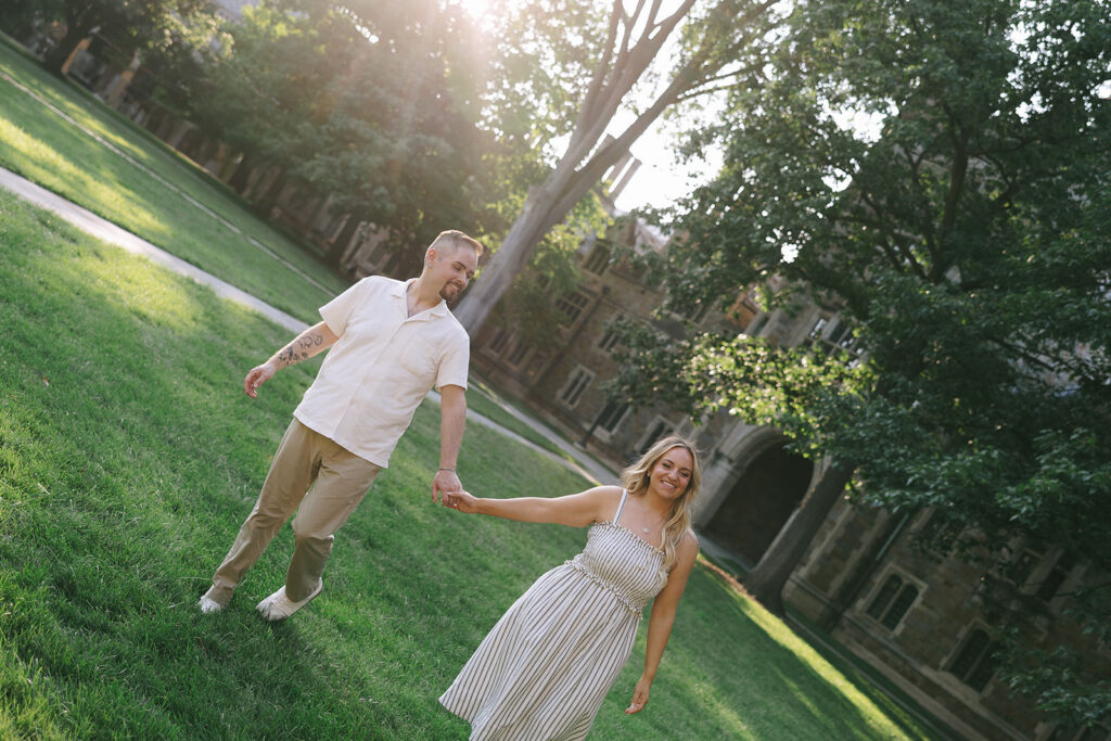 Candid engagement photo of a couple laughing outdoors, an example of using engagement photos for a guest book print