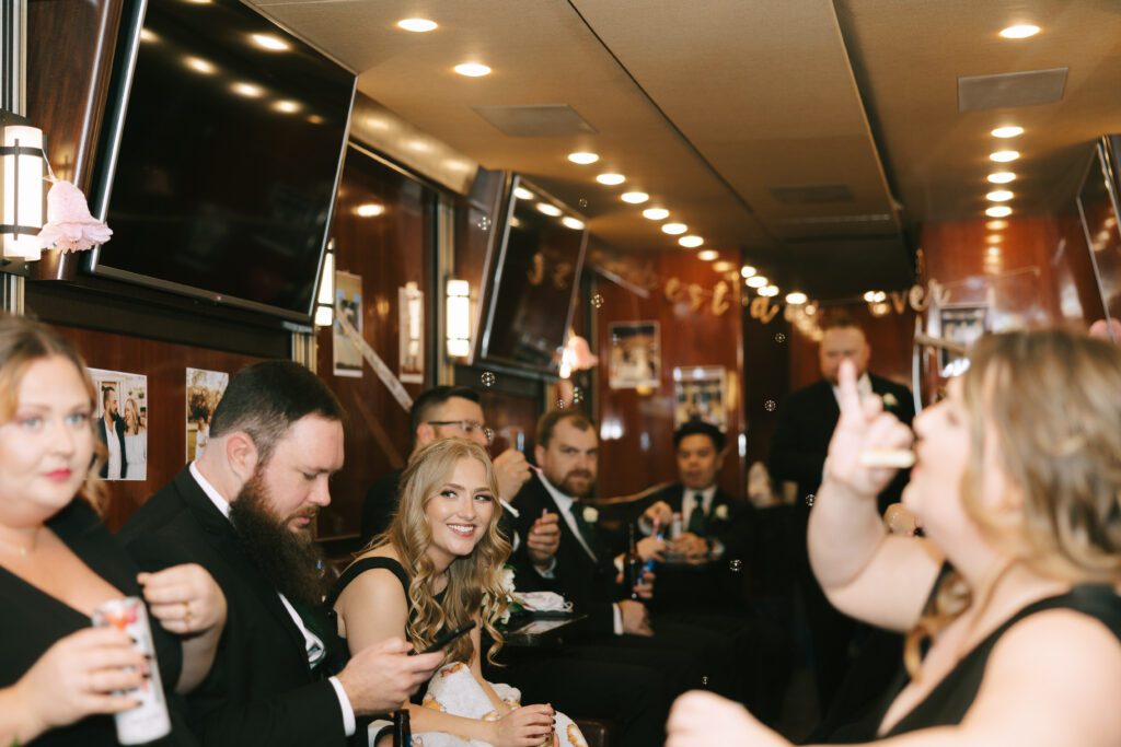 Kirsten and Jeff on their party bus for their Michigan Wedding